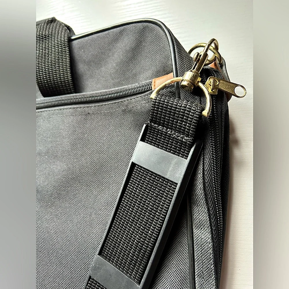 EUC black messenger tote adjustable shoulder strap handles gold hardware